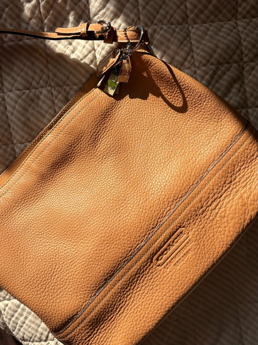 Coach Pebbled Leather Duffel in Tan with Multi-Tag Charm